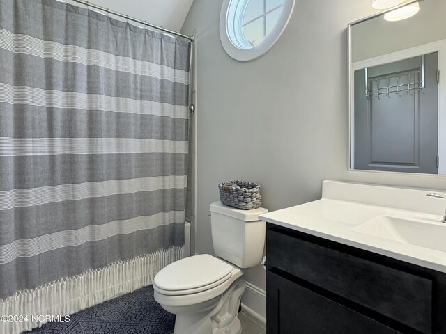 full bathroom featuring lofted ceiling, shower / bath combo, toilet, and vanity