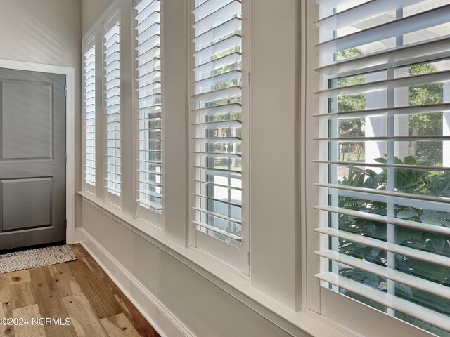 doorway to outside with hardwood / wood-style floors