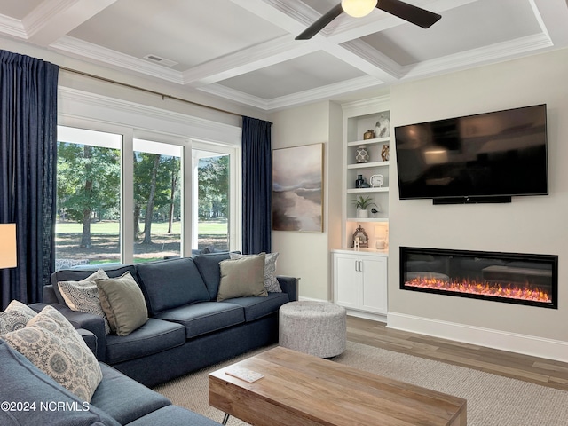 living room with ornamental molding, ceiling fan, coffered ceiling, and hardwood / wood-style flooring