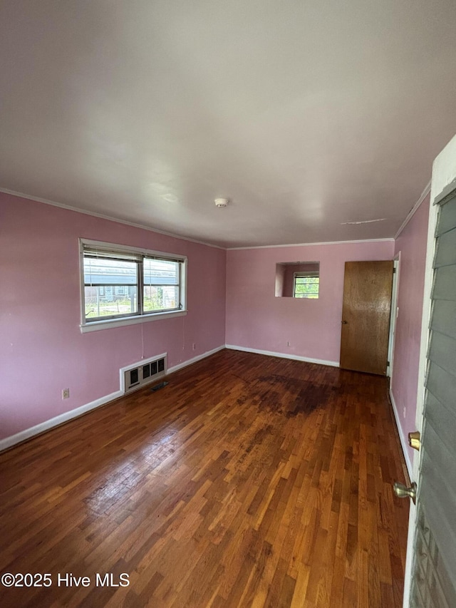 1208 S 9th St, Wilmington, NC 28401 - spare room featuring wood finished floors, crown molding, and baseboards