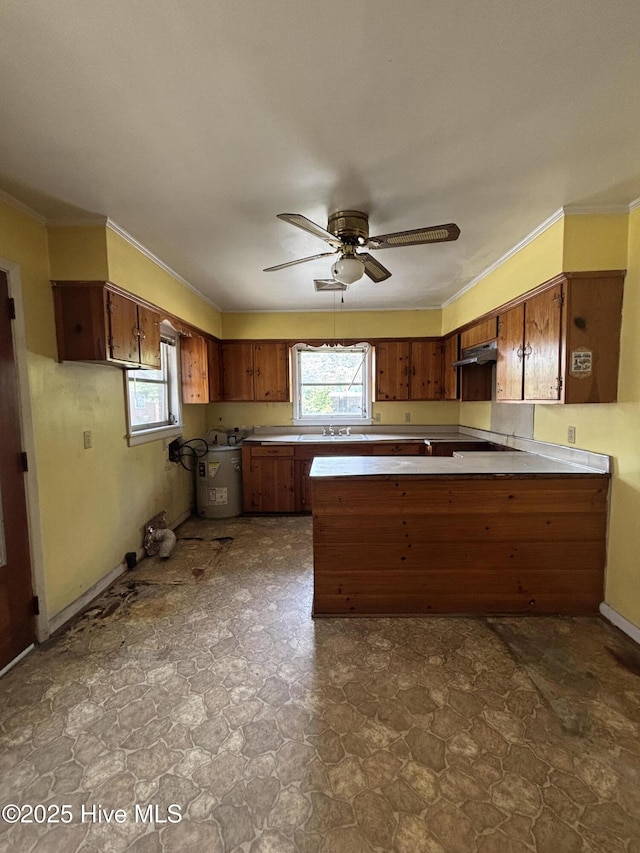 1208 S 9th St, Wilmington, NC 28401 - kitchen featuring a peninsula, ventilation hood, healthy amount of natural light, crown molding, and ceiling fan
