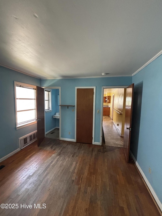 1208 S 9th St, Wilmington, NC 28401 - unfurnished bedroom with dark wood-style floors and baseboards