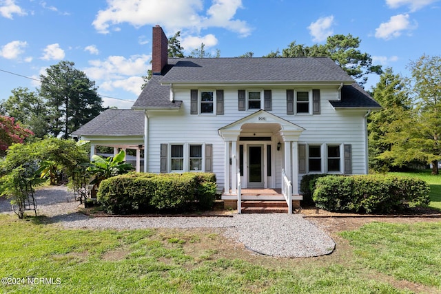 colonial home with a front yard