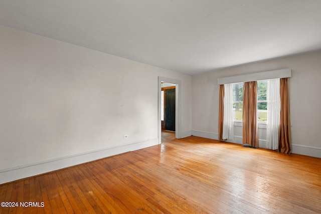 unfurnished room featuring light hardwood / wood-style flooring