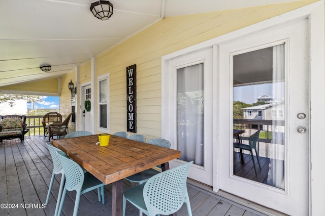 wooden terrace featuring a porch