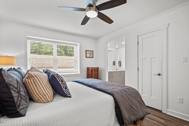 bedroom with hardwood / wood-style floors, ceiling fan, ensuite bathroom, crown molding, and sink