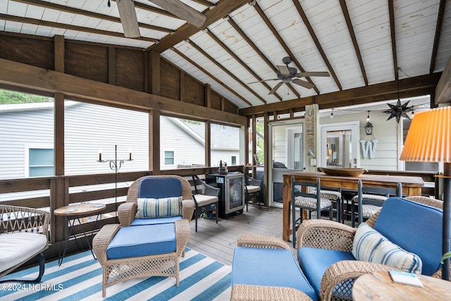 sunroom / solarium with lofted ceiling with beams and ceiling fan