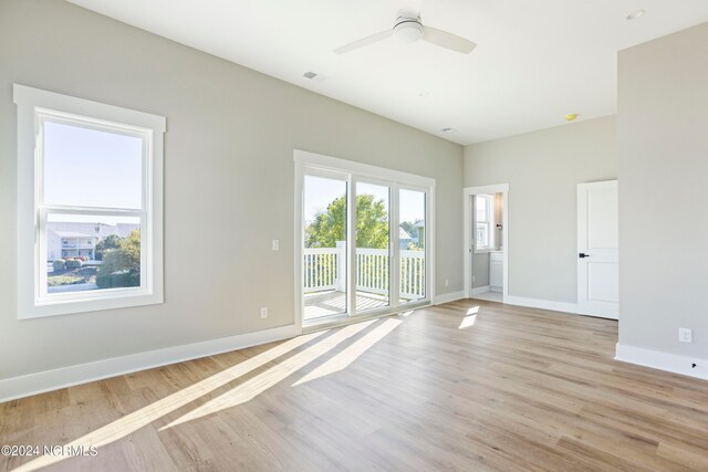 unfurnished room featuring light hardwood / wood-style floors and ceiling fan