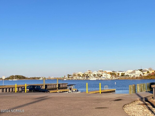 property view of water featuring a boat dock