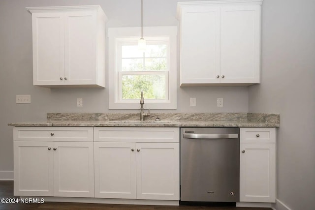 kitchen with light stone countertops, dishwasher, sink, and white cabinetry