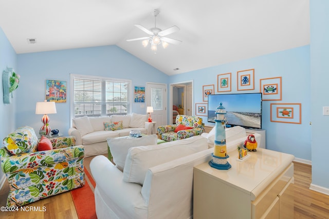 living room with vaulted ceiling, light hardwood / wood-style flooring, and ceiling fan