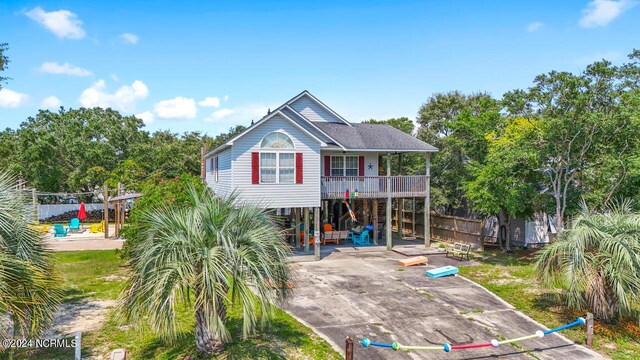 rear view of house featuring a carport