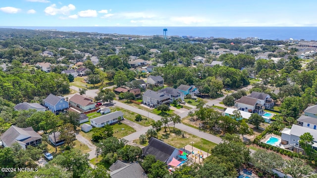 birds eye view of property featuring a water view and a residential view