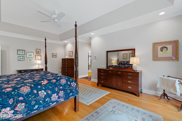 bedroom with light wood-type flooring, crown molding, baseboards, and recessed lighting