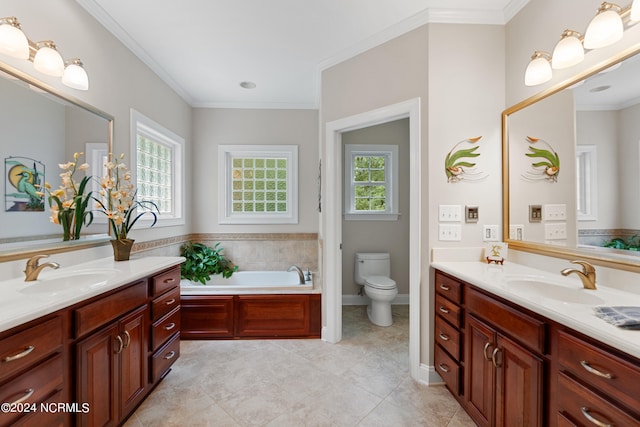 full bath featuring two vanities, a sink, and a wealth of natural light