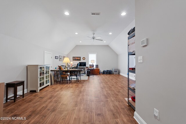 office featuring vaulted ceiling, hardwood / wood-style flooring, and ceiling fan