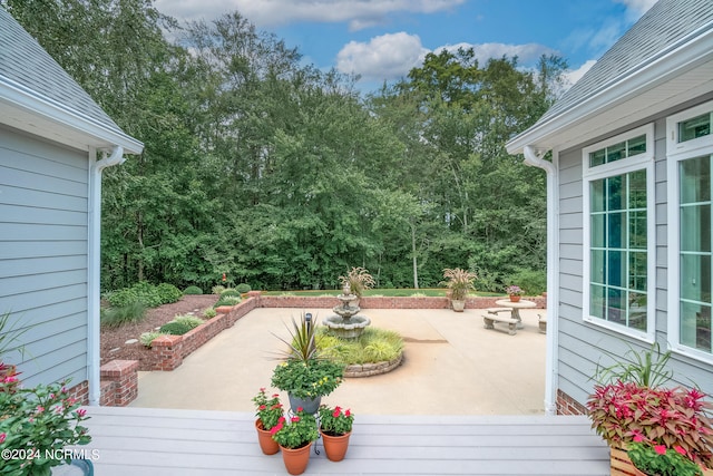 wooden deck featuring a patio area