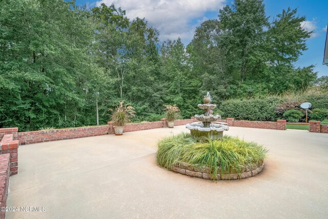 surrounding community featuring a patio area