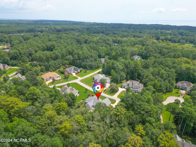 aerial view featuring a residential view and a view of trees