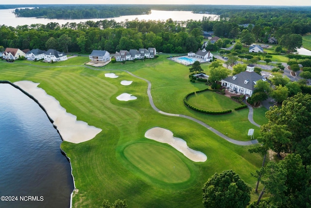 bird's eye view featuring golf course view and a water view