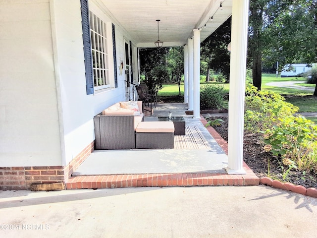 view of patio featuring a porch