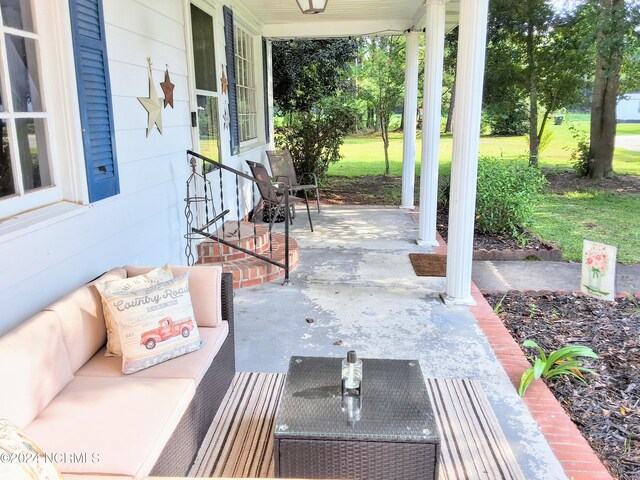 view of patio featuring a porch