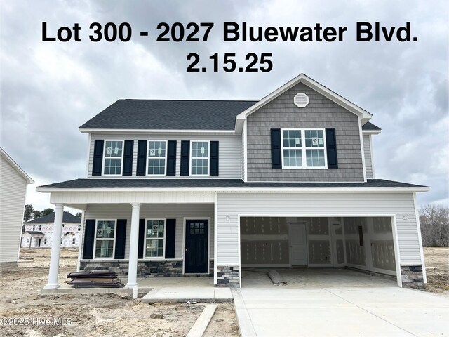 view of front of house with a garage and covered porch