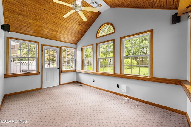 unfurnished sunroom featuring ceiling fan, vaulted ceiling, and wooden ceiling