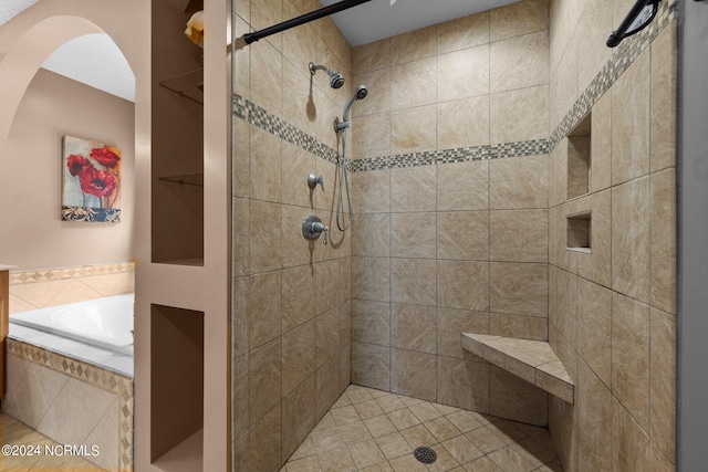 bathroom featuring plus walk in shower