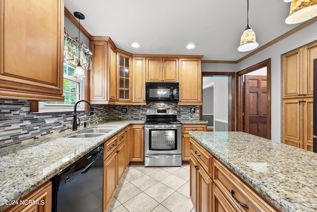 kitchen with sink, light stone countertops, black appliances, and backsplash