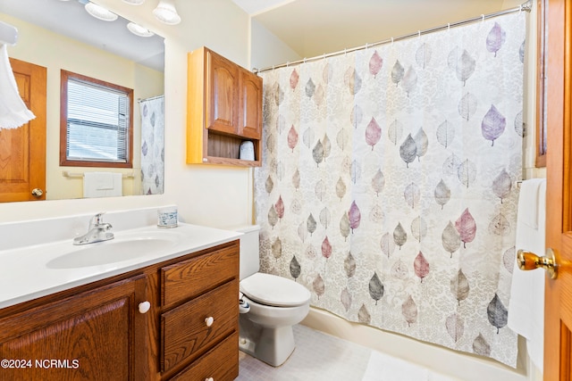 bathroom with vanity, toilet, and a shower with shower curtain