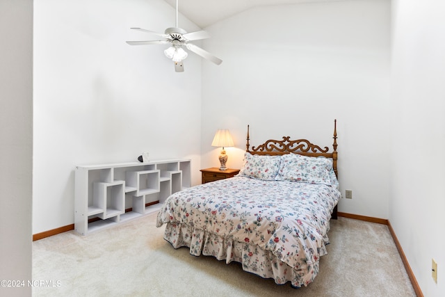 carpeted bedroom with vaulted ceiling and ceiling fan