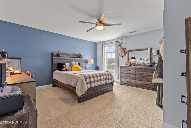 carpeted bedroom with ceiling fan