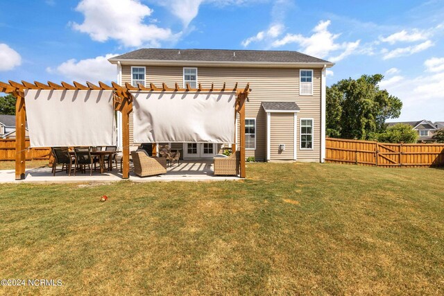 back of house featuring a pergola, a yard, and a patio area