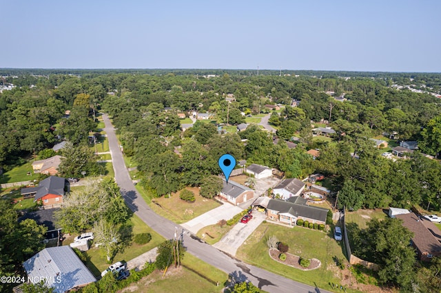 birds eye view of property featuring a residential view and a view of trees