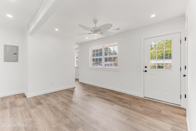 interior space featuring visible vents, light wood-style flooring, electric panel, and baseboards