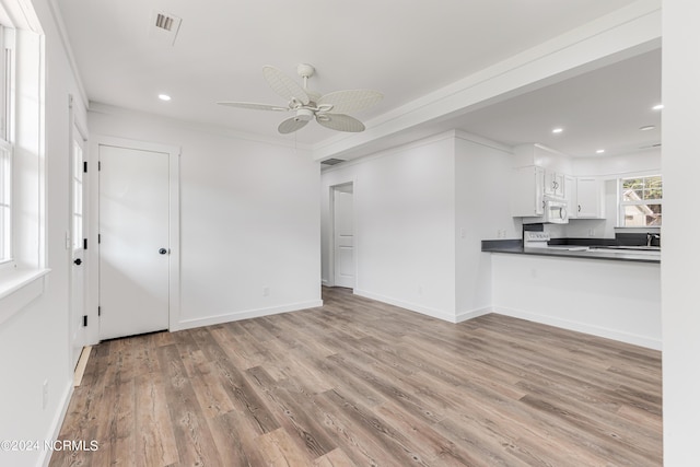 unfurnished living room with a ceiling fan, light wood-type flooring, baseboards, and recessed lighting