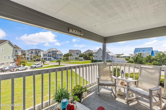 balcony featuring a residential view and covered porch