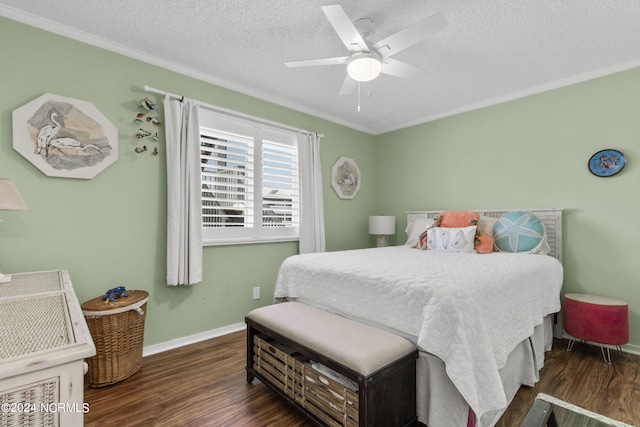 bedroom with a textured ceiling, dark wood-type flooring, ceiling fan, and ornamental molding