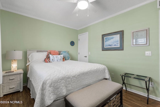 bedroom with crown molding, dark hardwood / wood-style flooring, ceiling fan, and a textured ceiling