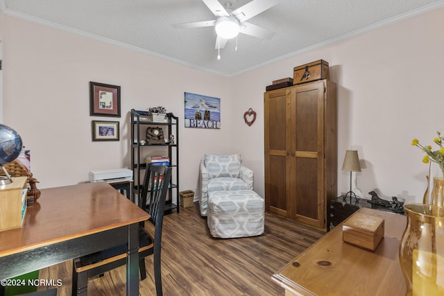 office area featuring dark wood-style floors, ceiling fan, ornamental molding, and a textured ceiling