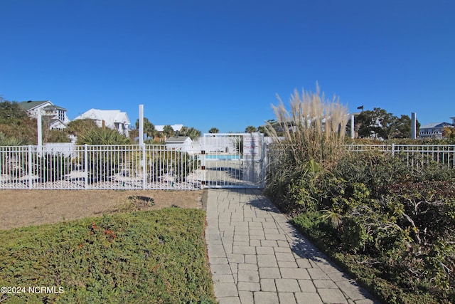 view of gate featuring fence