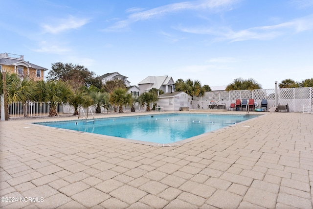 view of swimming pool featuring a patio area