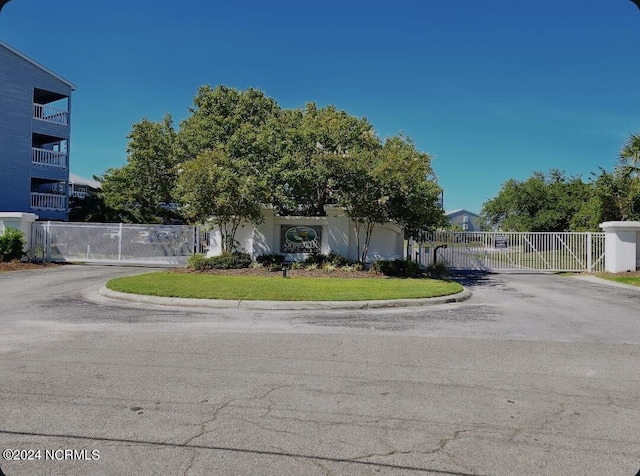 view of front of home featuring a gate and fence