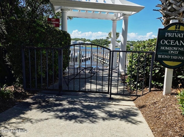 view of gate featuring a pergola