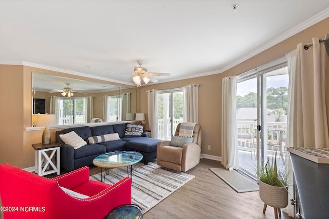 living room with ceiling fan, crown molding, french doors, and light hardwood / wood-style floors