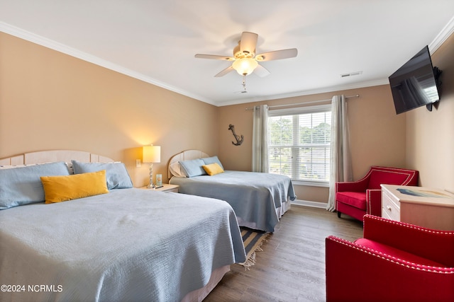 bedroom with ceiling fan, hardwood / wood-style flooring, and crown molding