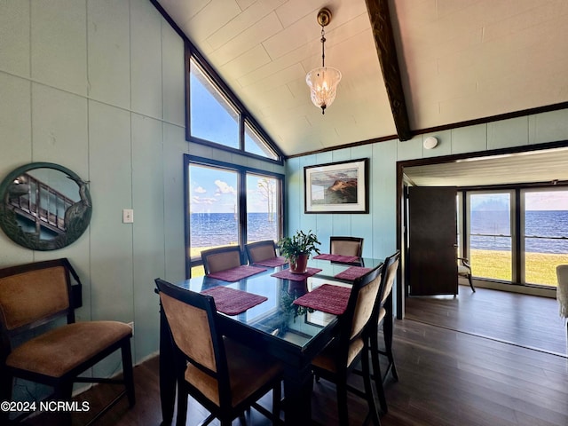 dining room featuring beam ceiling, dark hardwood / wood-style flooring, a water view, and high vaulted ceiling