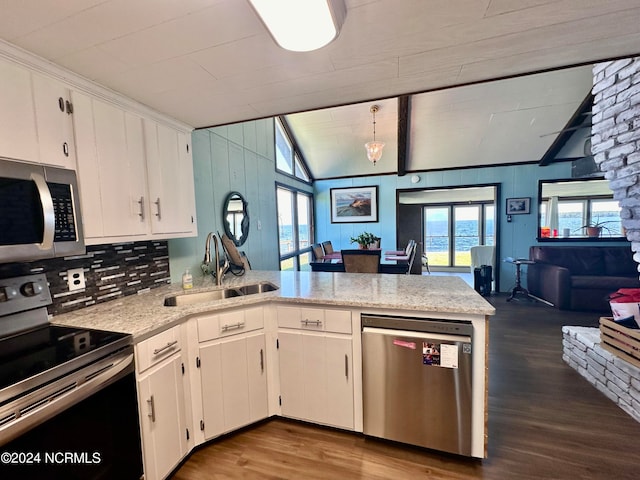 kitchen with white cabinetry, sink, vaulted ceiling, and appliances with stainless steel finishes