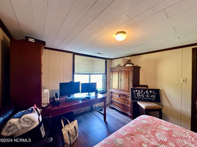 bedroom featuring crown molding, dark wood-type flooring, and wooden ceiling